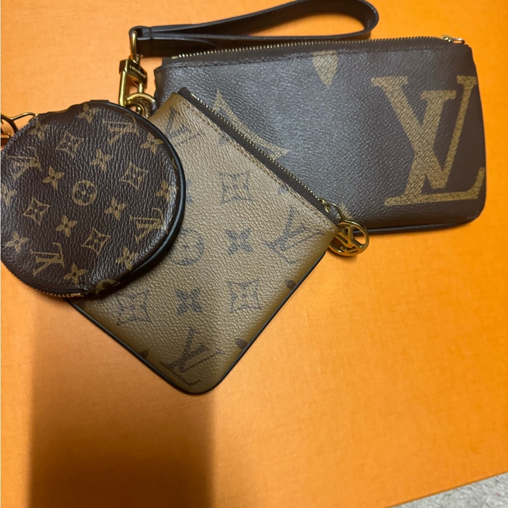 Authentic- Louis Vuitton Trio Pouch Set Reverse Monogram